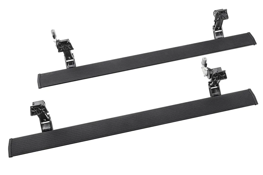 AMP Research PowerStep retractable electric running board extended below a truck door
