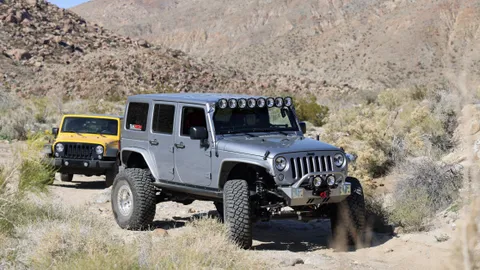 Jeep Wrangler climbing rocks