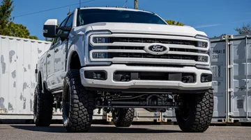 Ford F-250 lift kit shown in a real-world setting