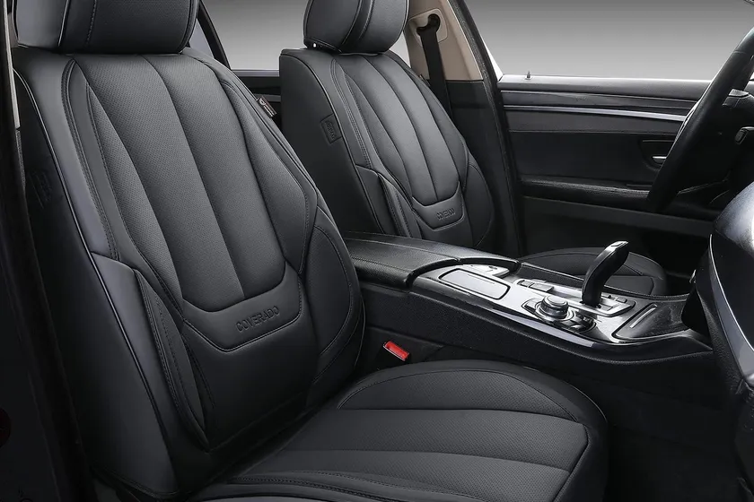 Black Coverado waterproof faux leather seat covers installed on front and rear car seats