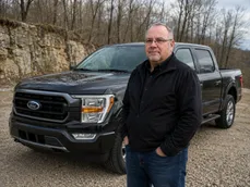 Dale Harper standing in front of his Ford F-150 Raptor