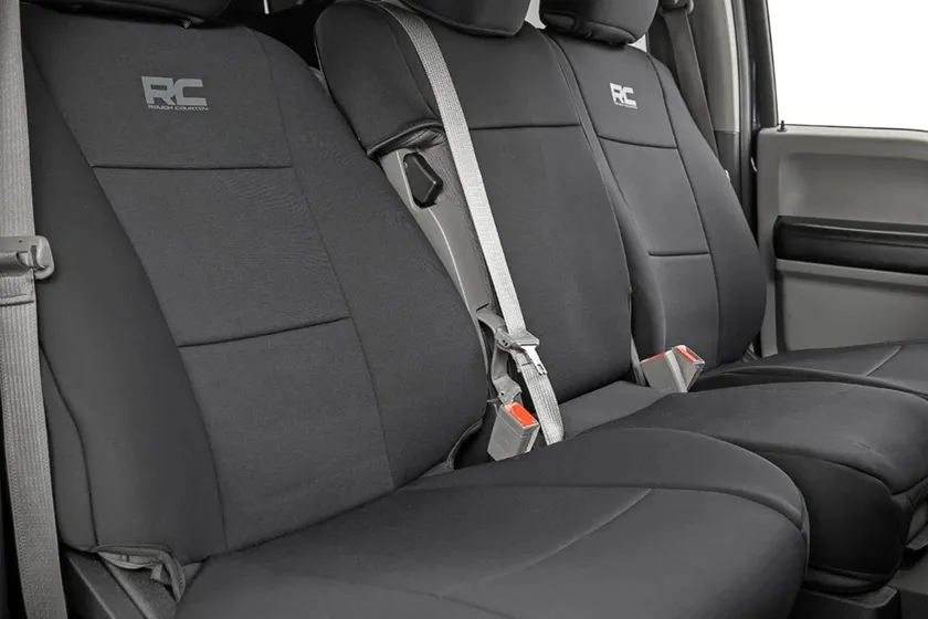 Rough Country black neoprene front bench and rear seat covers installed in a Ford F-350 Super Duty crew cab
