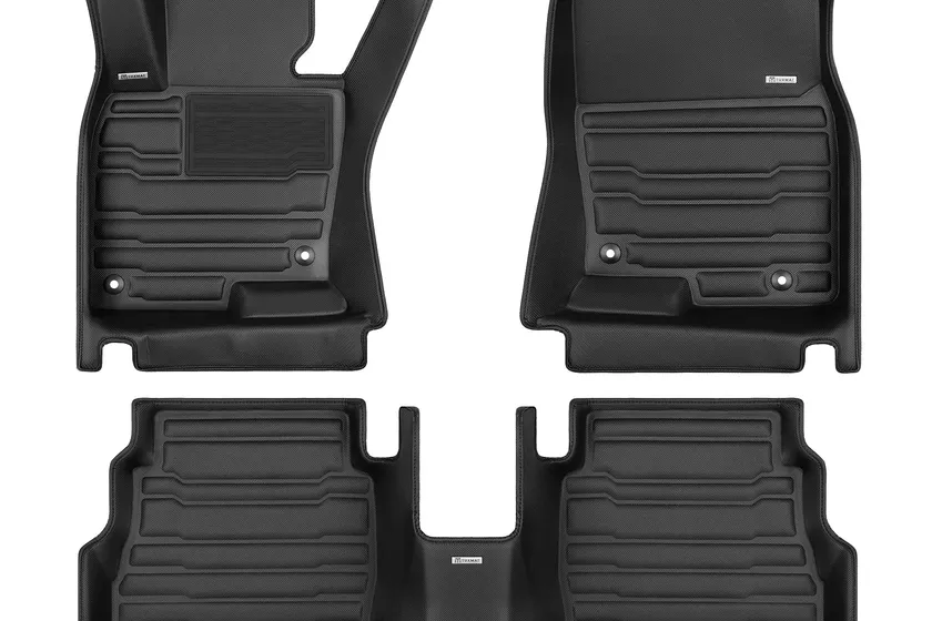 TuxMat custom car mats full set in black showing extended sidewall coverage reaching up to the door sills